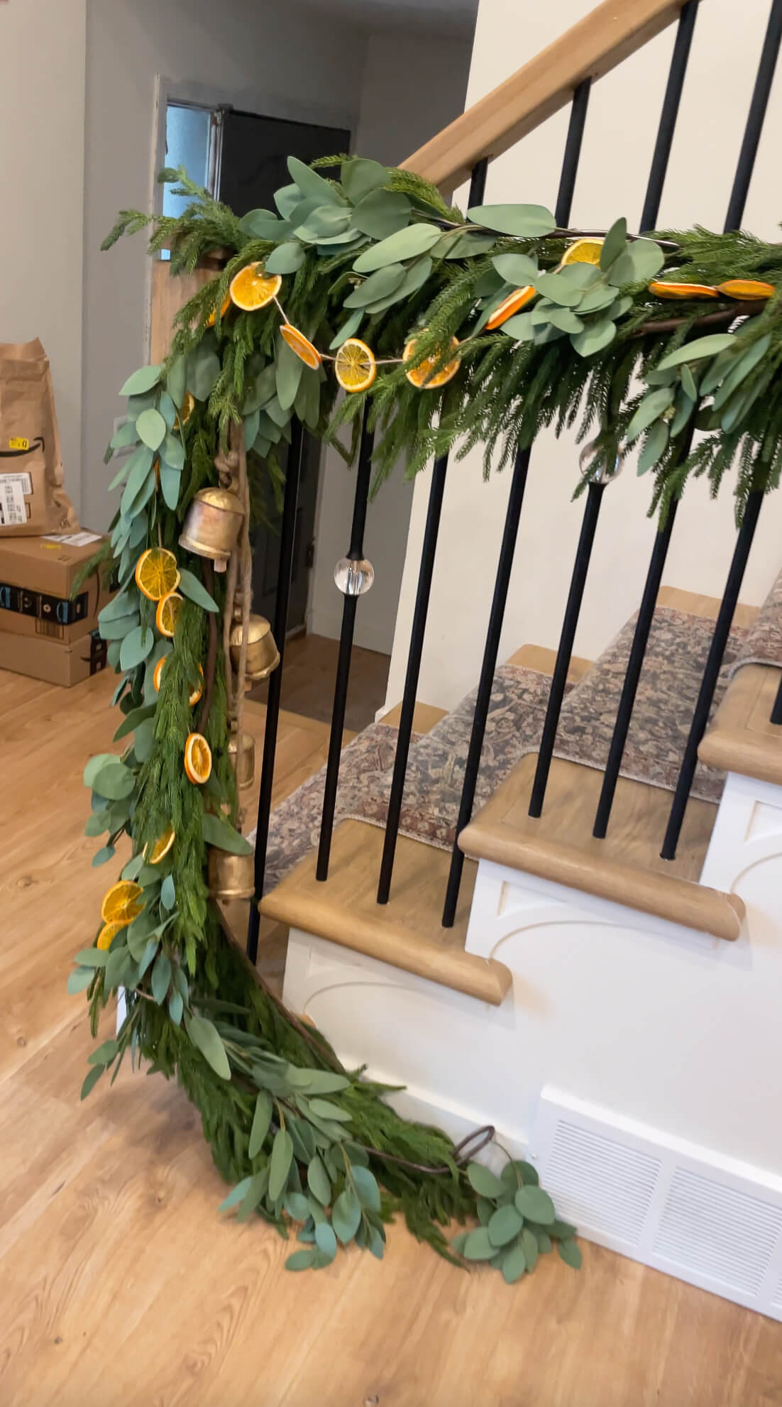 Three types of Christmas garland on a staircase.